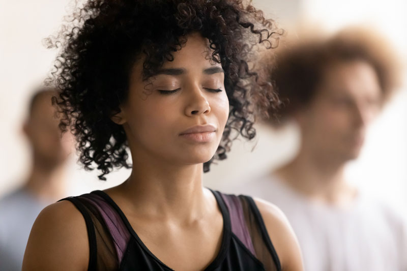 Woman managing her high functioning anxiety with deep breathing
